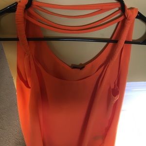 Sleeveless bright orange blouse